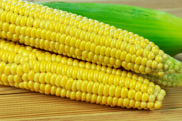 sweet corn on wooden table