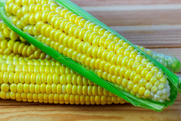 sweet corn on wooden table