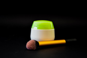 A bottle of household chemicals cosmetics on a black background neck of a bottle close up macro pattern