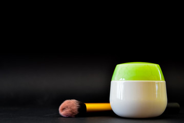 A bottle of household chemicals cosmetics on a black background neck of a bottle close up macro...
