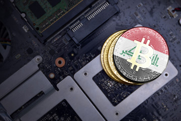 golden bitcoins with flag of iraq on a computer electronic circuit board. bitcoin mining concept.