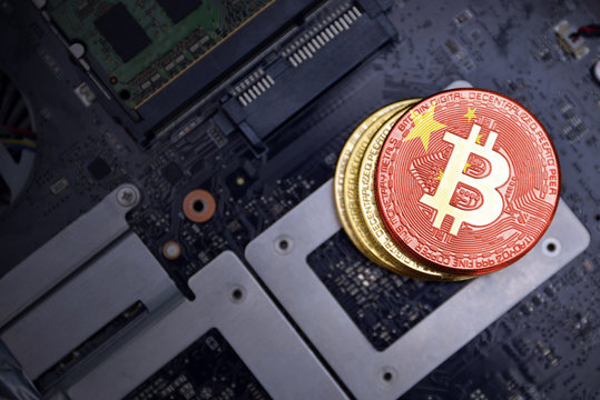 golden bitcoins with flag of china on a computer electronic circuit board. bitcoin mining concept.