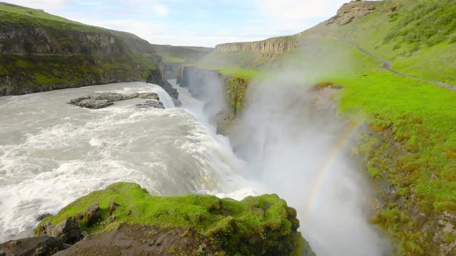 Iceland, Gullfoss waterfall. Captivating scene with rainbow of Gullfoss waterfall that is most powerful waterfall in Iceland and Europe. Picturesque summer scene with amazing Icelandic waterfall.