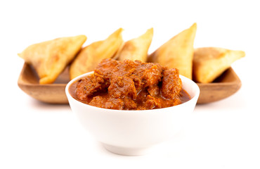 Creamy Tomato Based Chicken Tikka Massala Isolated on a White Background