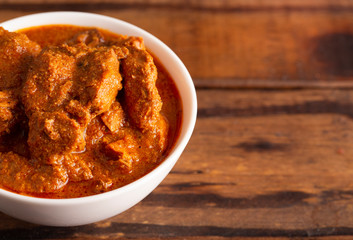 Dinner Set with Chicken Tikka Massala on a Wooden Table