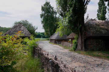 Old Ukrainian house. Ukrainian hut of the nineteenth century. Summer landscape, sunshine. Village Pirogovo.