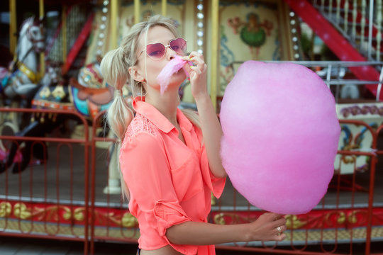 Woman Eating Cotton Candy.