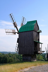 Fototapeta na wymiar Old windmill. Ukrainian mill of the nineteenth century. Summer landscape, sunshine. Village Pirogovo.
