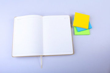 Open White notepad with colorful sticky reminder notes