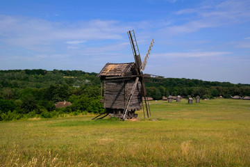 Fototapeta premium Old windmill. Ukrainian mill of the nineteenth century. Summer landscape, sunshine. Village Pirogovo.