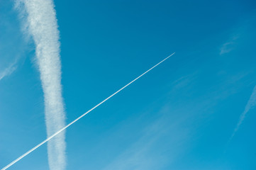 Trail of airplanes in the sky