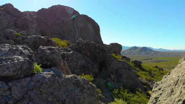 Rock Formation Fly Over Aerial. aerial view rising on a rock formation in the middle of southwest desert scene