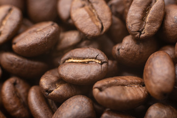 Coffee beans. Macro image of brown roasted coffee beans background.