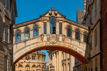 Fototapeta na wymiar Close-up of the Hertford Bridge, known as the Bridge of Sighs against a clear sky. This is the skyway connecting the two parts of Hertford College on New College Lane in Oxford, England, UK, Europe.