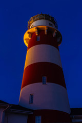 lighthouse on the sea at sunset