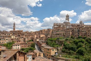 Panoramic view of Siena city with historic buildings and street