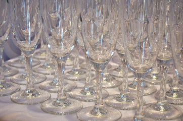 Empty glasses for wine or champagne are on table, side view