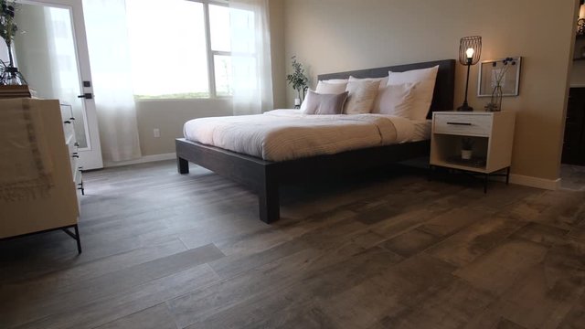 Master Bedroom Rise From Floor Wide Angle. view moves up on a master bedroom scene with nice d&eacute;cor down to the hardwood floors