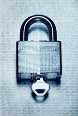 Concept digital security and encryption with binary code overlaid on steel padlock and key on...