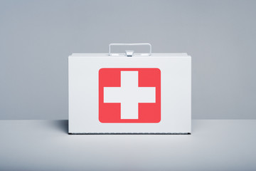 Metal first aid kit on grey background