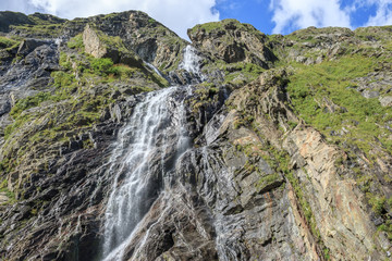 Panorama view of waterfall scene in mountains, national park of Dombay, Caucasus