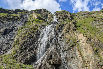 Panorama view of waterfall scene in mountains, national park of Dombay, Caucasus