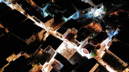 Aerial drone night shot from iconic illuminated main town of Mykonos island, Cyclades, Greece