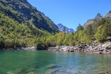 Fototapeta na wymiar Closeup view of lake scenes in mountains, national park Dombay, Caucasus