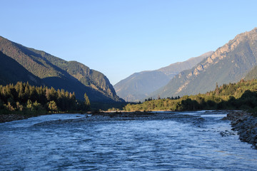 Panorama view of river scene in mountains of national park Dombay, Caucasus