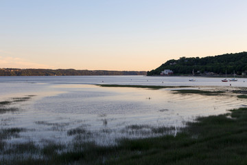 Boats moored in the St. Lawrence River in the Cap-Rouge bay area of Quebec City during a blue hour summer evening