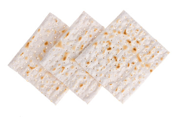 Background with crackers matzoh( matzah, matzo) isolated on white
