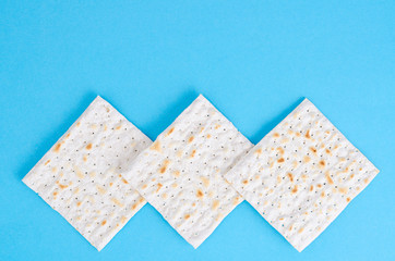 Matzah for passover on blue background. 