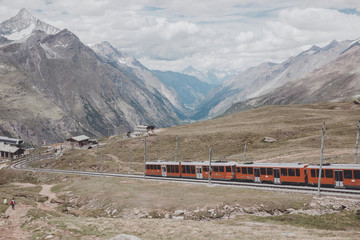 Gornergrat train with tourist is going to Matterhorn mountain