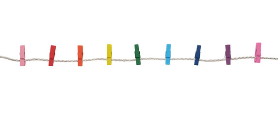 Multicolored wooden clothespins on a rope isolated on white background