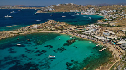 Aerial drone, bird's eye view photo of famous beach of Platy Gialos, Mykonos island, Cyclades, Greece