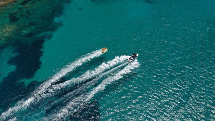 Aerial drone photo of extreme powerboat donut watersports crusing in high speed in famous sandy...