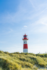 Lighthouse red white on dune. Sylt island – North Germany.  