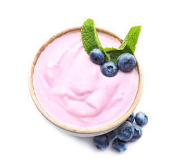 Bowl with tasty blueberry yogurt on white background