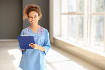 Young African-American nurse in clinic
