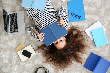 Young African-American student preparing for exam at home