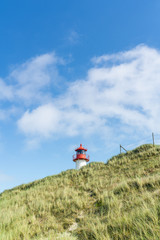Lighthouse red white on dune. Sylt island – North Germany.  