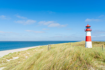 Lighthouse red white on dune. Sylt island – North Germany.  