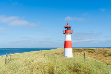 Lighthouse red white on dune. Sylt island – North Germany.  