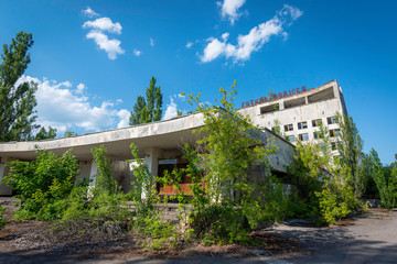 Fototapeta na wymiar Abandoned building in Chernobyl Exclusion Zone, Ukraine - June 2019 Ghost City Prypiat abandoned after Chernobyl disaster - nuclear accident in Soviet Union that occurred on 26 April 1986.