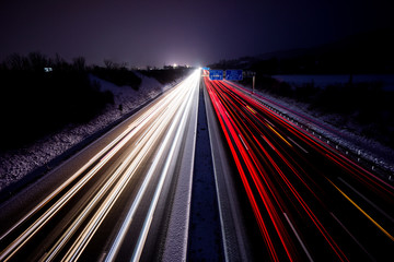 Fototapeta na wymiar Freeway at night busy dynamic driving