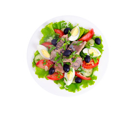 Salad of fresh vegetables, egg, canned fish and olives. 