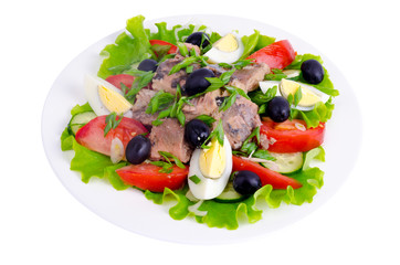 Salad of fresh vegetables, egg, canned fish and olives. 