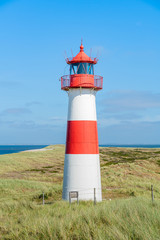 Lighthouse red white on dune. Sylt island &ndash; North Germany.  
