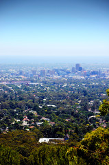 Spectacular views overlooking Adelaide city, South Australia, framed by trees and native Australian...