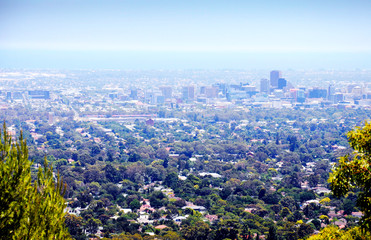 Spectacular views overlooking Adelaide city, South Australia, framed by trees and native Australian bushland, taken at Skye Lookout.